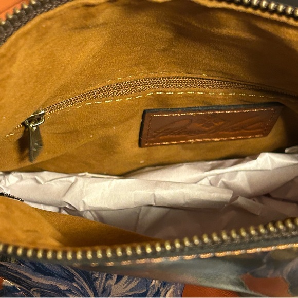 Brand New Patricia Nash fold over leather wristlet (still in & attached to box)